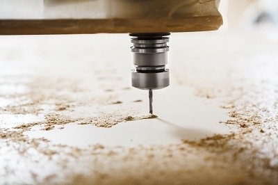 What is a CNC router used for