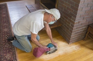 Man Sanding Wood Floors