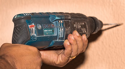 Man using Bosch cordless drill